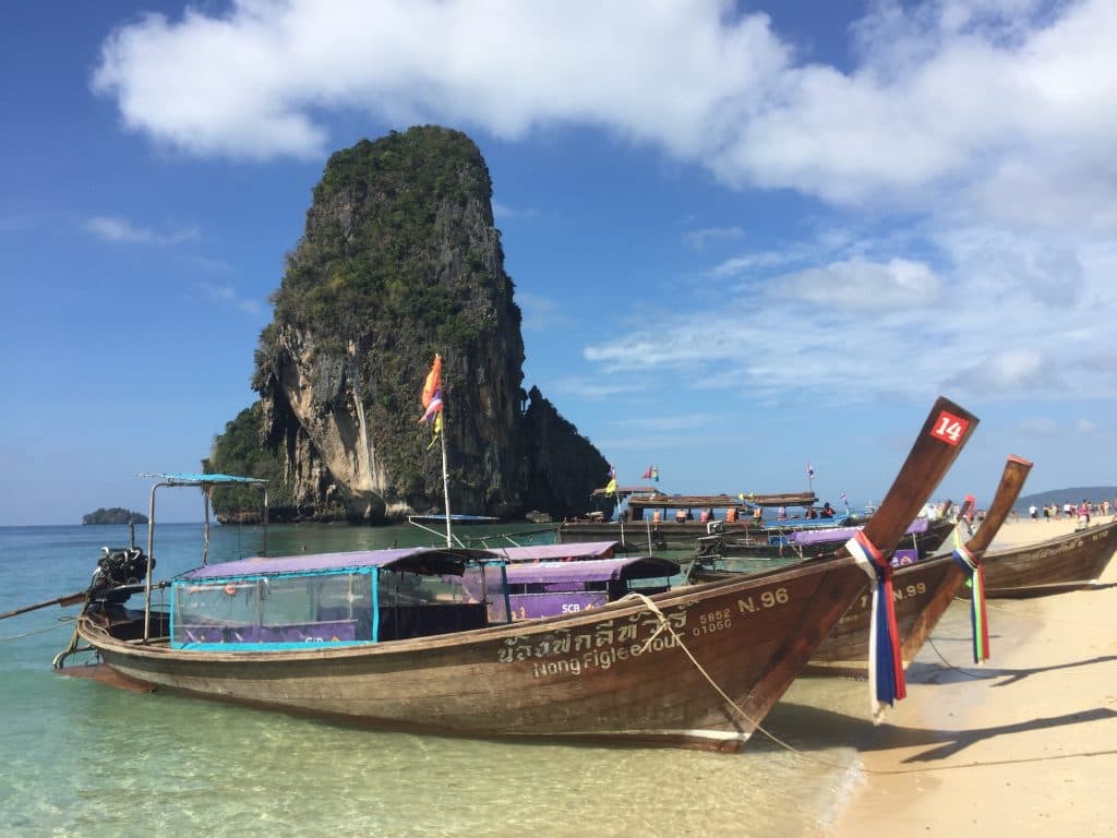 A boat, beach, rock